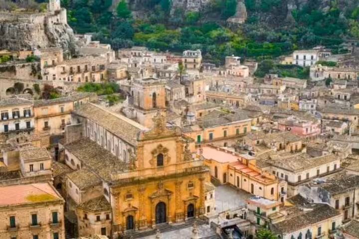 Aerial view of Modica old town and baroque church, scenic stop on Taormina to Syracuse tour in Sicily