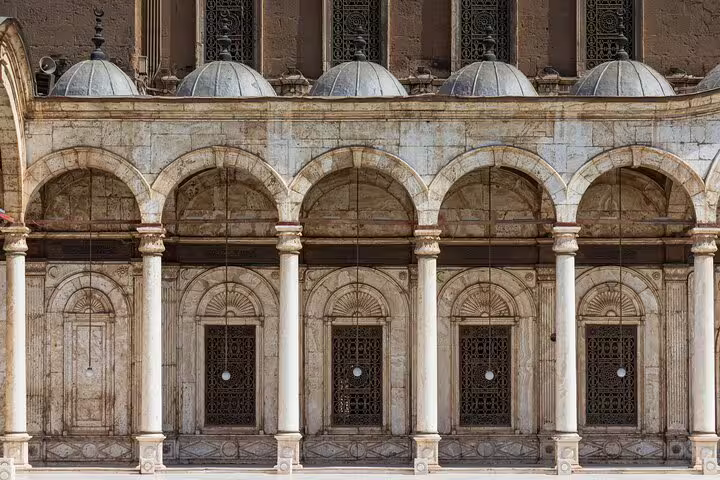 Arched colonnade and domed courtyard at Mohamed Ali Mosque, Cairo Citadel, on a private guided tour