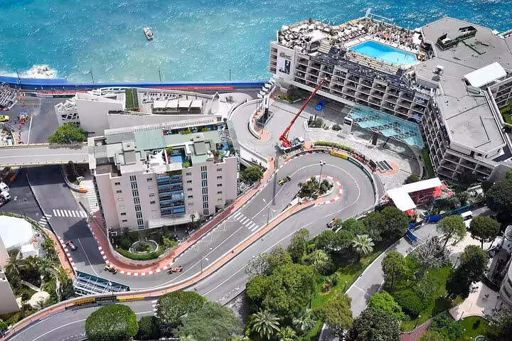 Scenic view of Monaco's famous Grand Prix circuit with winding roads and coastal backdrop, perfect for a half-day tour.