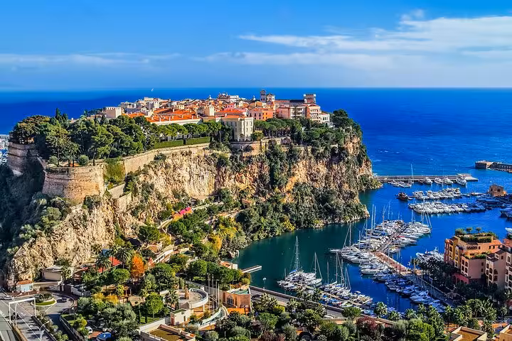 Aerial view of Monaco's Prince's Palace rock with luxury yacht harbor and Mediterranean Sea