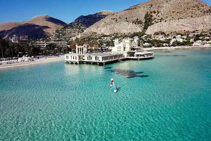 Aerial view of Mondello Beach near Palermo with turquoise water, Liberty-style pier and mountains on a private Sicily day tour