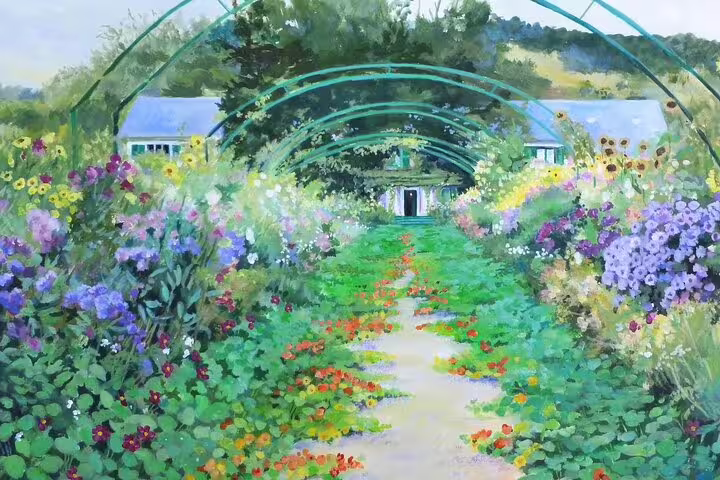 Painted garden path with floral arches leading to Monet's house in Giverny, France