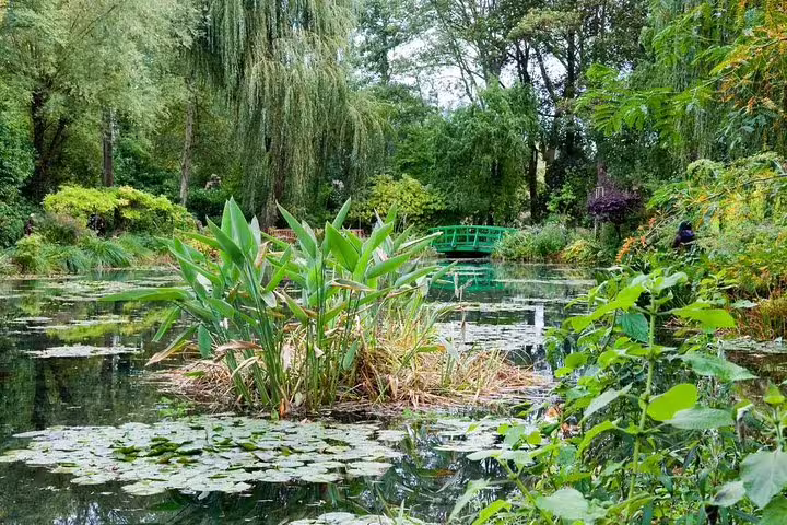 Japanese bridge over Monet’s lily pond at Giverny, visited on a Versailles and Giverny private day trip