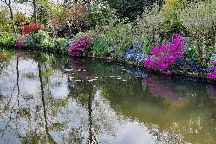 Water lily pond and colorful spring blooms at Monet’s Garden, Giverny, on a private Paris day trip with tickets