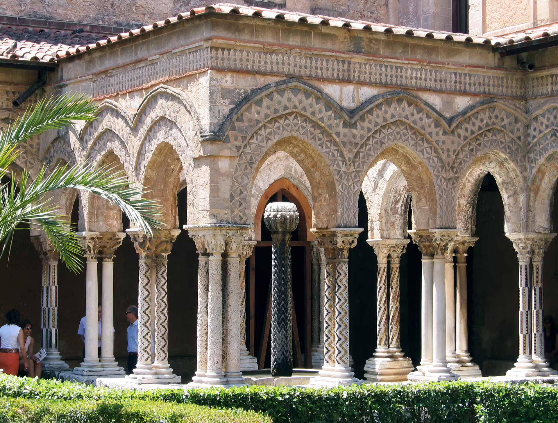 Cloister arches and ornate columns of Monreale Cathedral near Palermo, a highlight of the private Monreale and Mondello tour