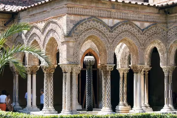 Cloister arches and ornate columns of Monreale Cathedral near Palermo, visited on a private Monreale and Mondello tour in Sicily