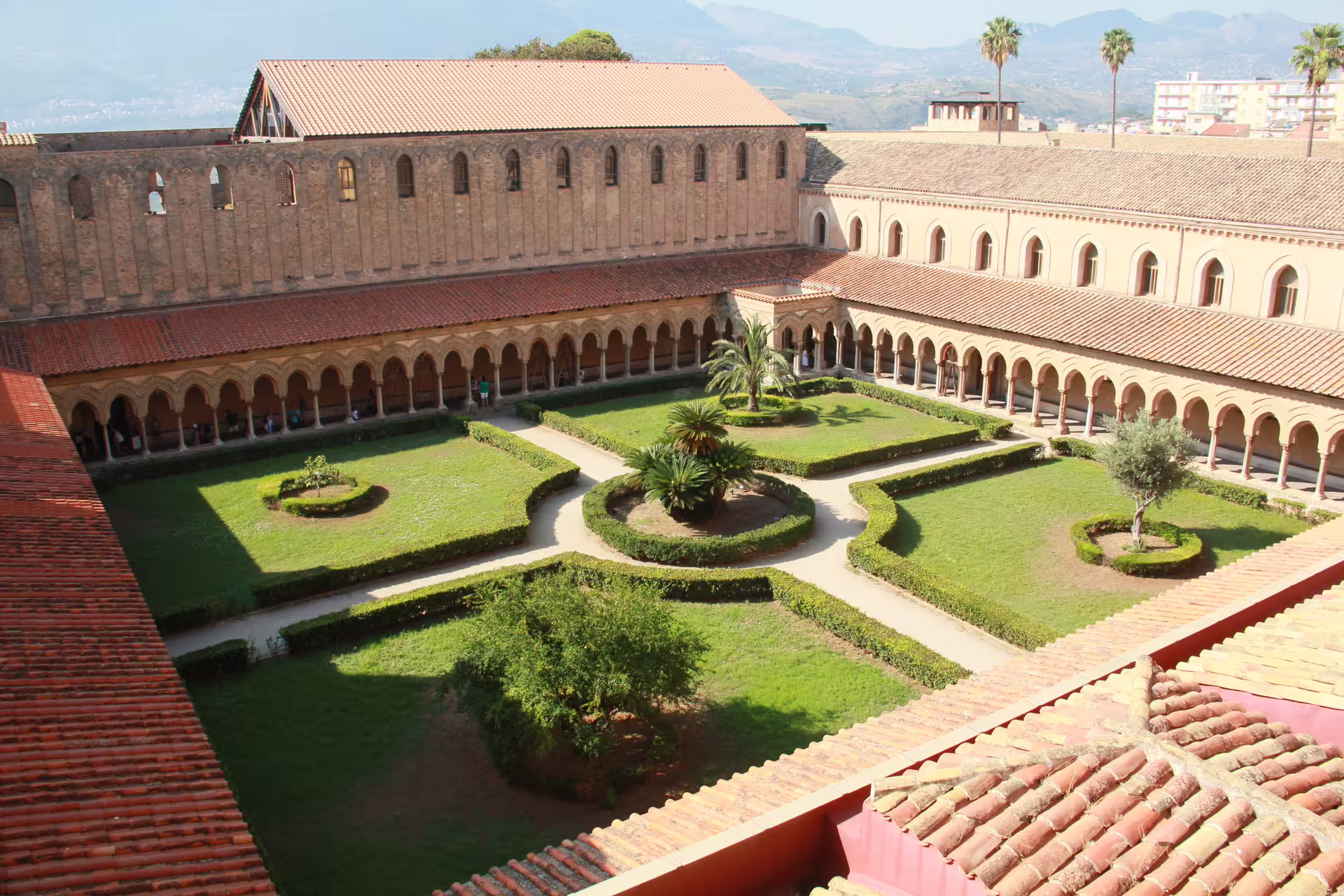 Panoramic view of Monreale Cathedral cloister gardens near Palermo, a highlight of the private Monreale and Mondello day trip