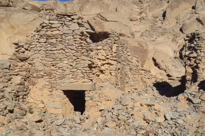 Ancient stone ruins at Mons Claudianus near Safaga, Egypt, seen on a desert jeep safari adventure tour