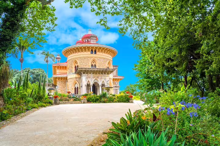 Monserrate Palace in Sintra surrounded by lush gardens, a highlight of the full-day tour from Lisbon including Pena Palace.