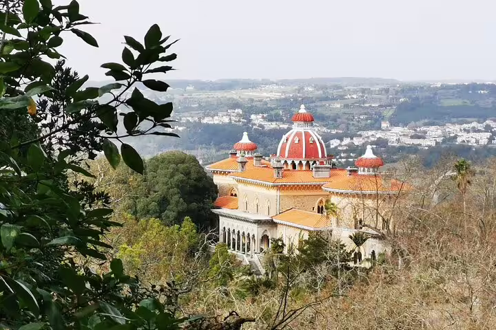 Stunning view of Monserrate Palace surrounded by lush greenery on a private tour from Lisbon to Sintra with monument tickets.