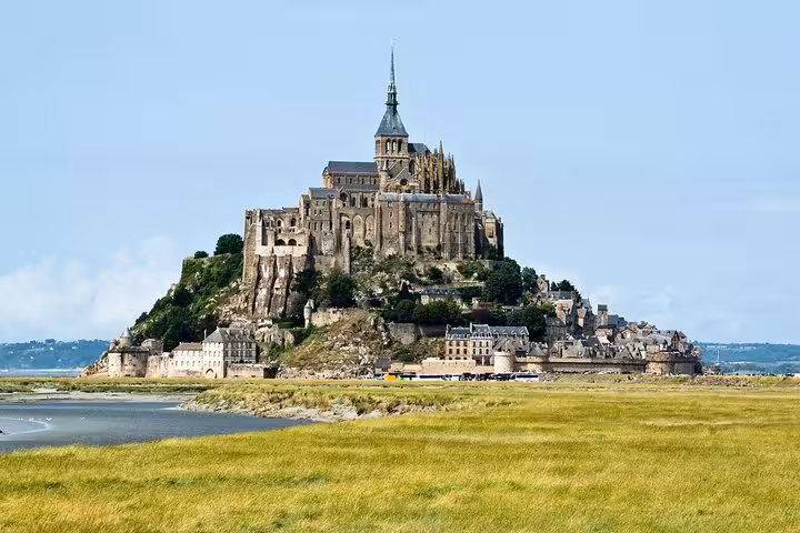 Mont-Saint-Michel abbey perched on rocky island surrounded by tidal flats, Normandy, France