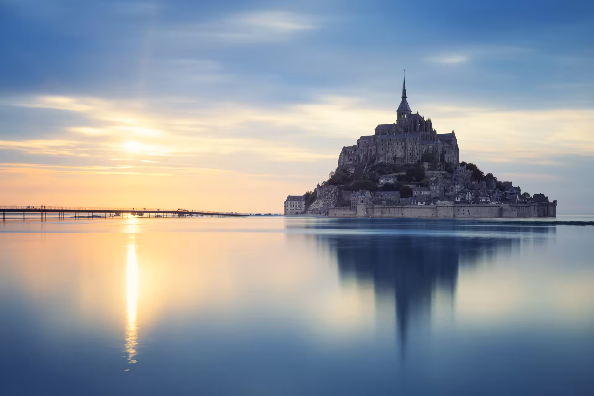 Mont Saint-Michel and Etretat Normandy day trip collage, luxury minivan small group tour from Paris