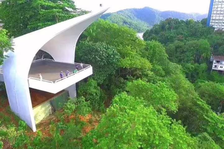 Aerial view of Mont Serrat observation deck in Santos, Brazil, surrounded by lush greenery and scenic landscapes.