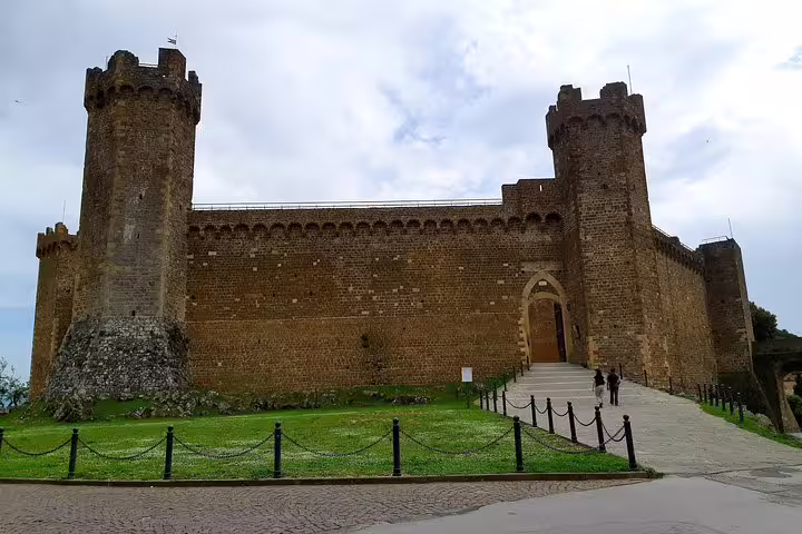 Medieval fortress in Montalcino overlooking vineyards, a highlight stop on the Brunello and Vino Nobile private wine tour
