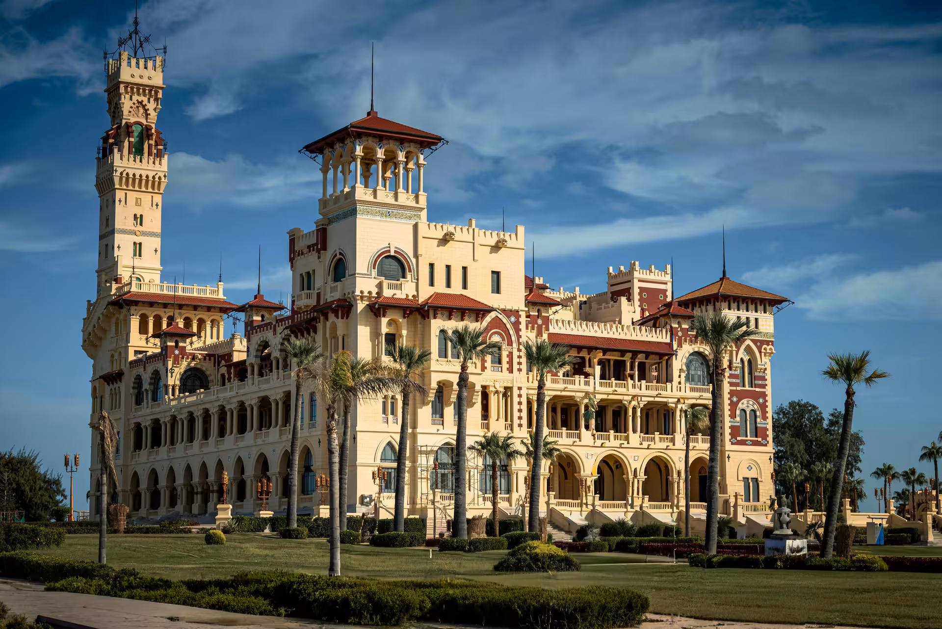Montaza Royal Palace grand facade with palm trees and gardens in Alexandria, Egypt