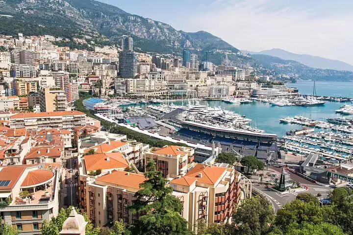 Monte Carlo harbor view with luxury yachts and Monaco skyline, featured stop on a private French Riviera tour