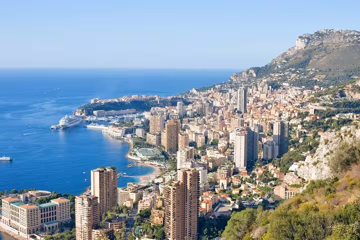 Marvel at the breathtaking panoramic view of Monte Carlo's skyline and coastline, showcasing luxury and natural beauty.
