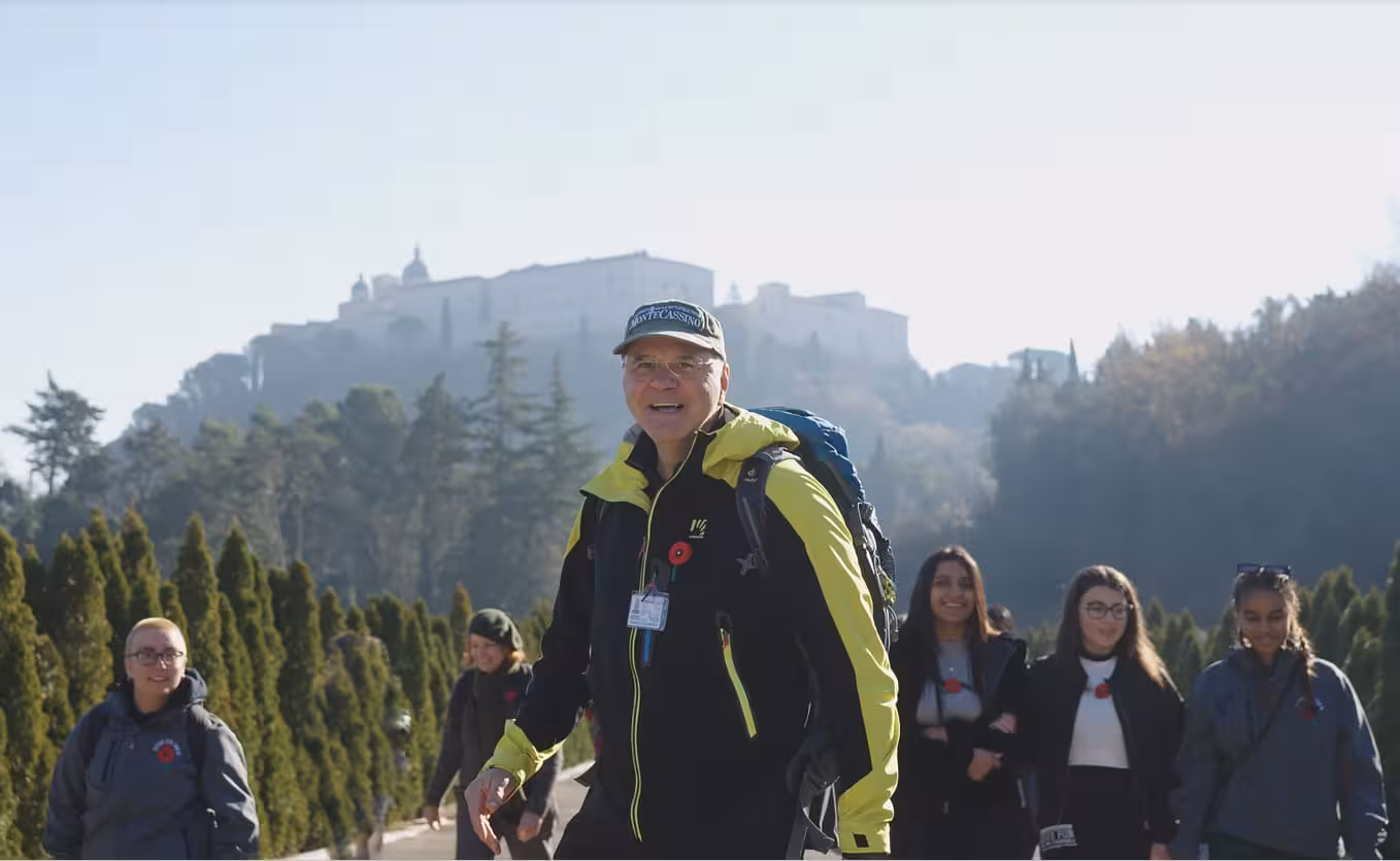 Group of tourists hiking near Monte Cassino Abbey on the L'Anello della Collina Imprendibile tour.
