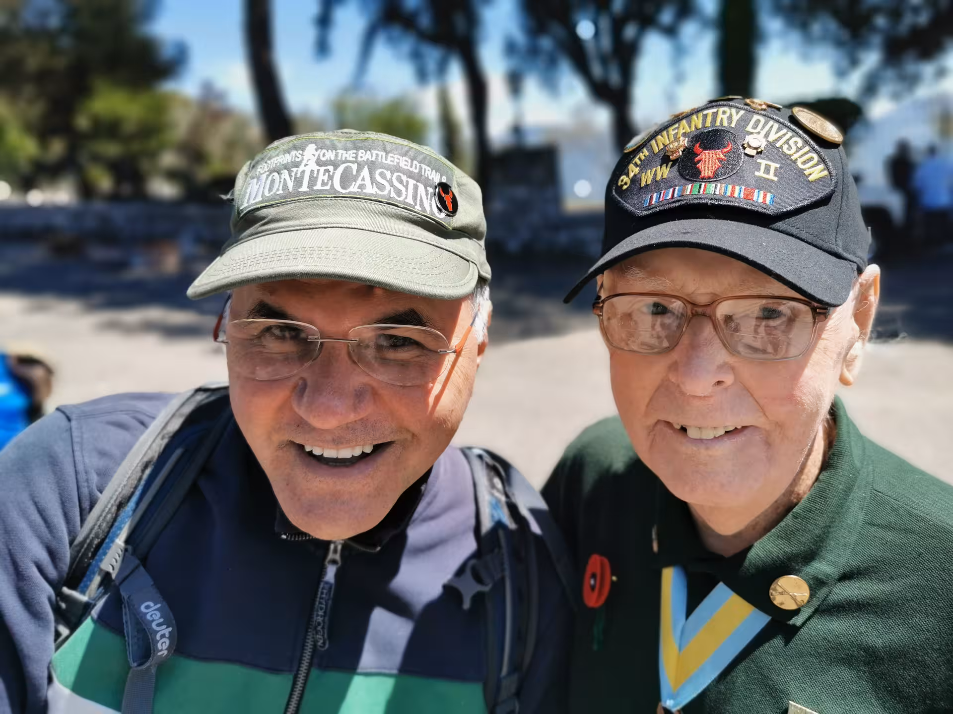 Visitors wearing commemorative hats at Monte Cassino, capturing the essence of the tailor-made walking experience.