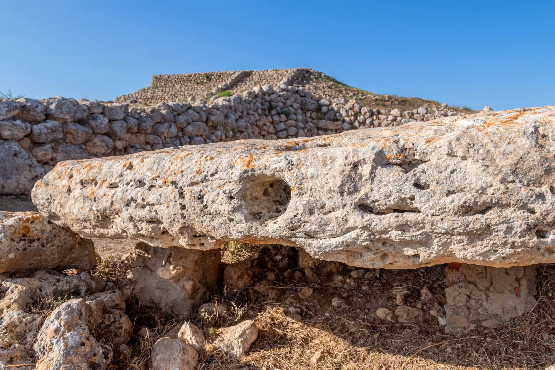 Close-up of ancient stone structure at Monte d'Accoddi, showcasing prehistoric architecture in Porto Torres.