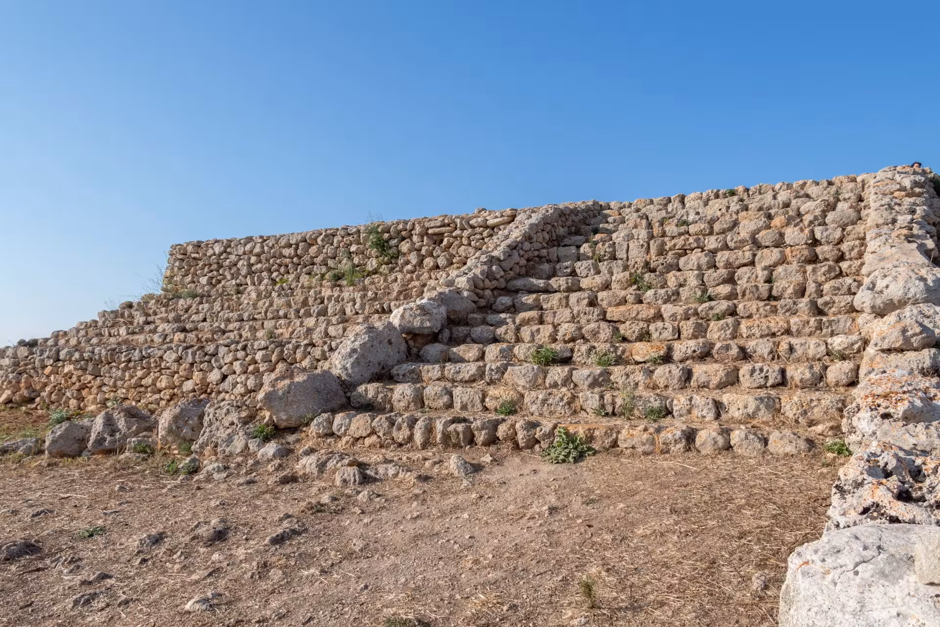 Close-up of Monte d'Accoddi's stone staircase revealing ancient architectural details.