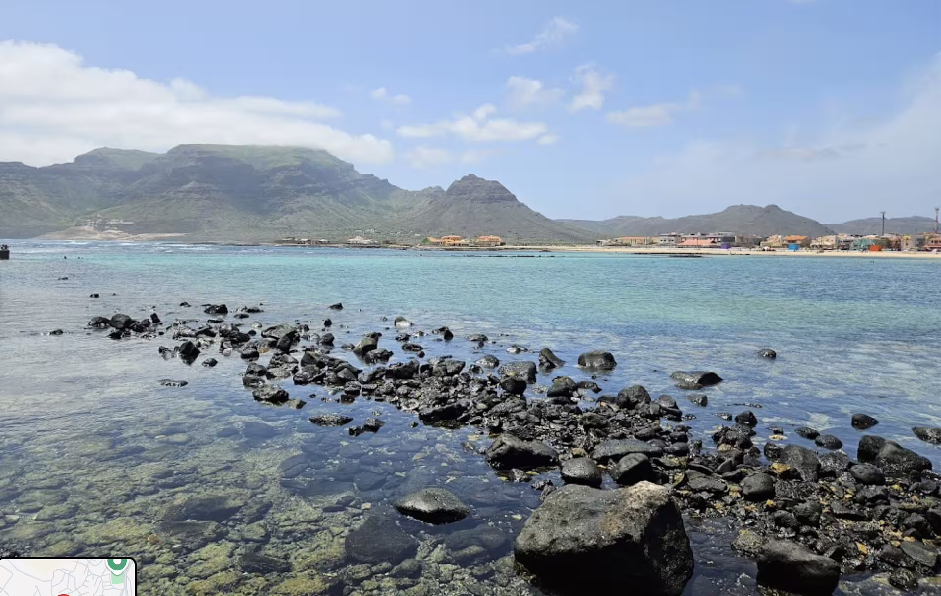 Scenic view of Monte Verde and São Vicente coastline featuring rocky shorelines and vibrant villages under a clear blue sky.