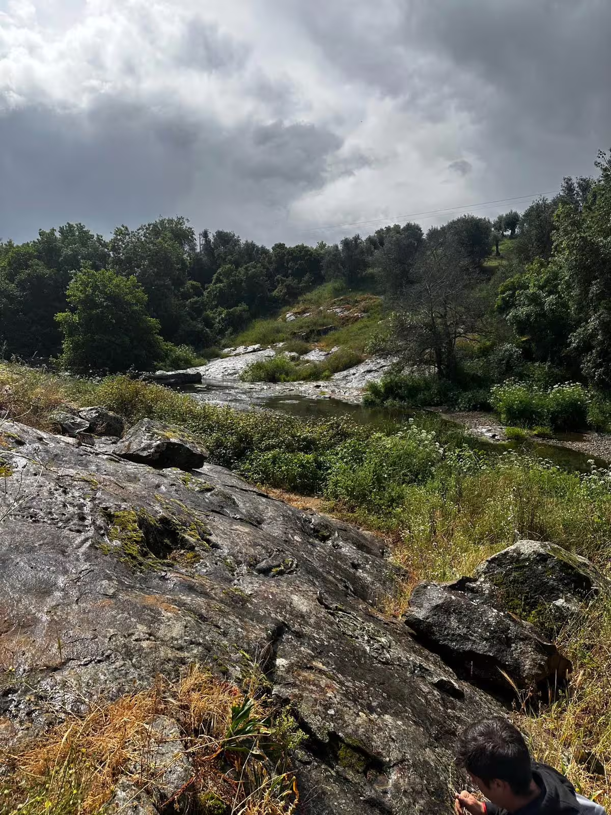 Overcast skies and rocky terrain in Montemor-o-Novo providing a rugged backdrop for a guided hiking adventure.