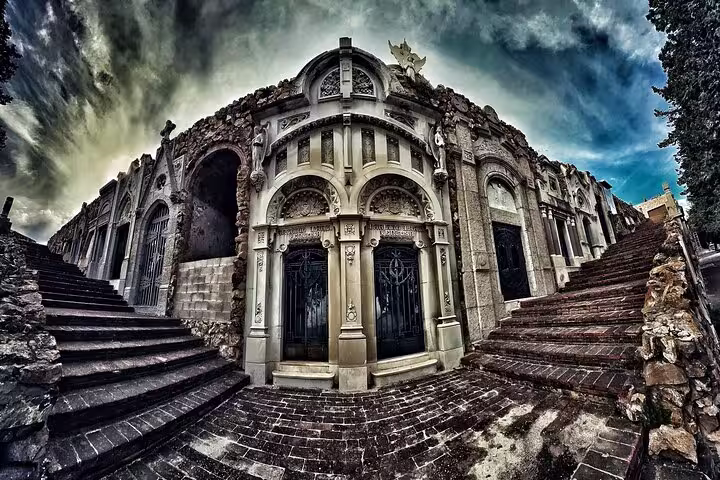 Dramatic architecture at Montjuïc Cemetery, showcasing intricate stonework and historic ambiance.