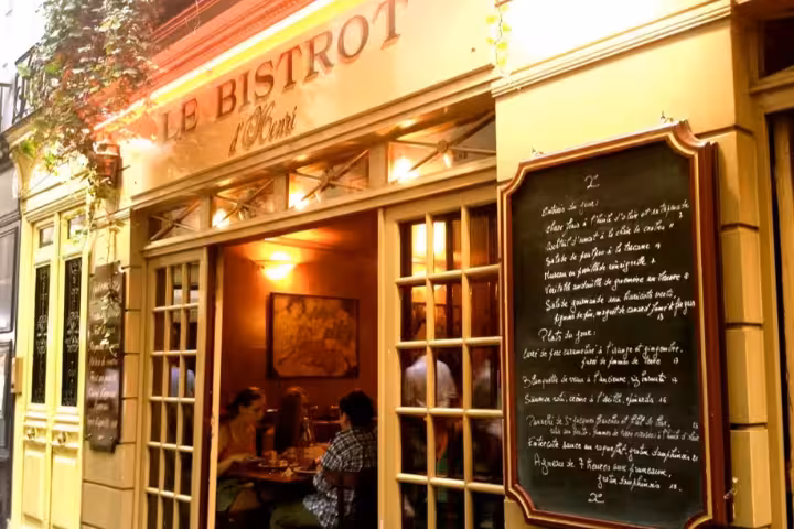 Charming French bistro with a chalkboard menu, inviting ambiance for a Montmartre walking and tasting tour.