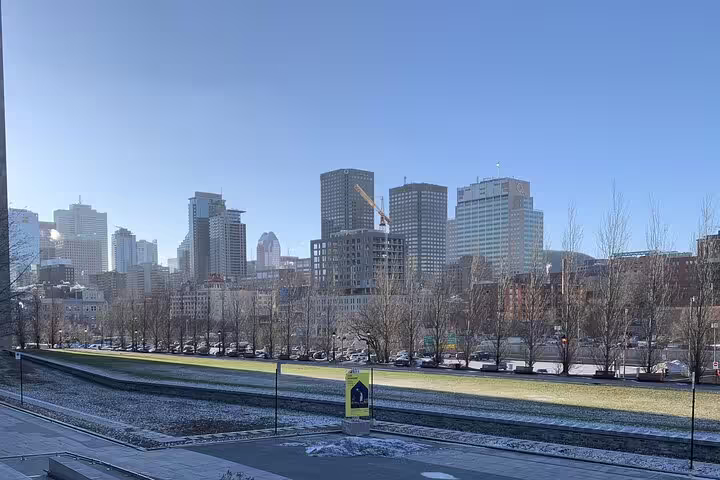 Montreal skyline with skyscrapers and park in winter, view from Old Town walking tour route