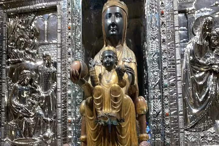 Explore the revered Black Madonna statue at Montserrat during your thrilling balloon ride over Igualada.