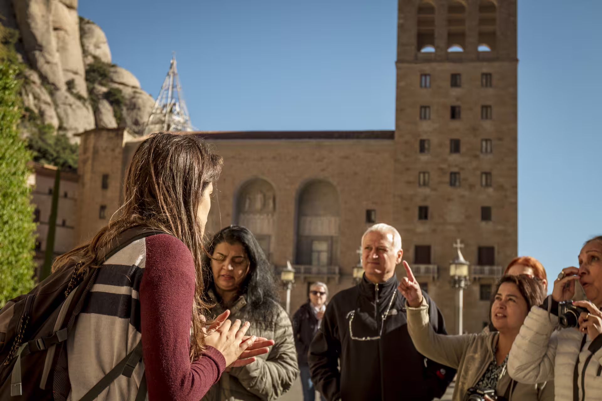 Tour guide with group at Montserrat Monastery