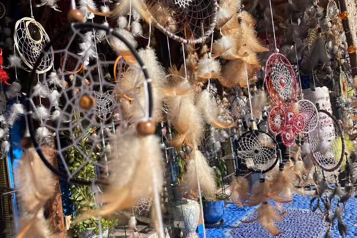 Handmade dreamcatchers and feathers in a Moroccan souk, artisan shopping on 12-day Tanger tour