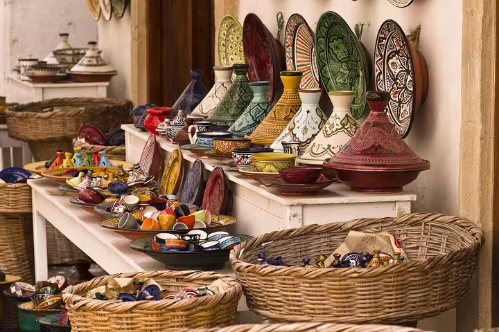 Traditional Moroccan pottery and tagines in a Marrakech market, ideal add-on to an Ouzoud Waterfalls tour
