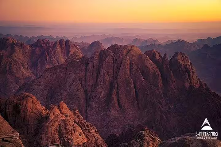 Sunrise over Sinai peaks from Moses Mountain summit on a private overnight trip from Dahab to St Catherine