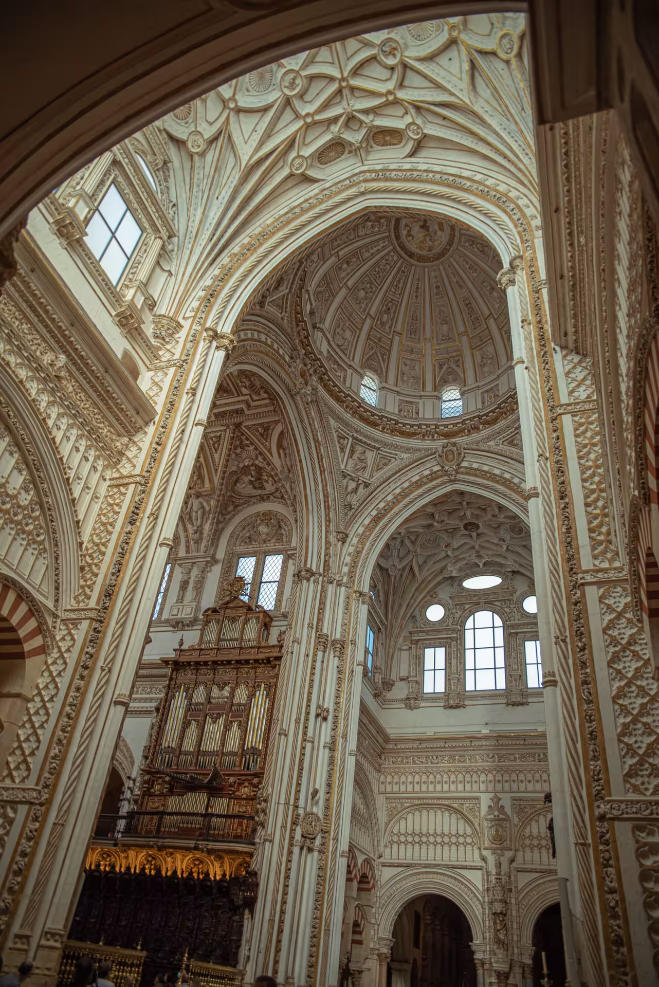 Marvel at the intricate domes and ornate architecture inside the historic Mosque-Cathedral of Córdoba.