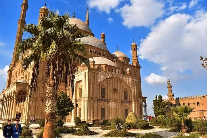 Mosque of Muhammad Ali at Cairo Citadel with palm gardens, key stop on Museum Citadel and Khan El Khalili tour