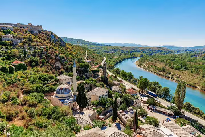 Scenic view of historic Mostar with its charming architecture and lush landscape along the river, on a day trip from Dubrovnik.