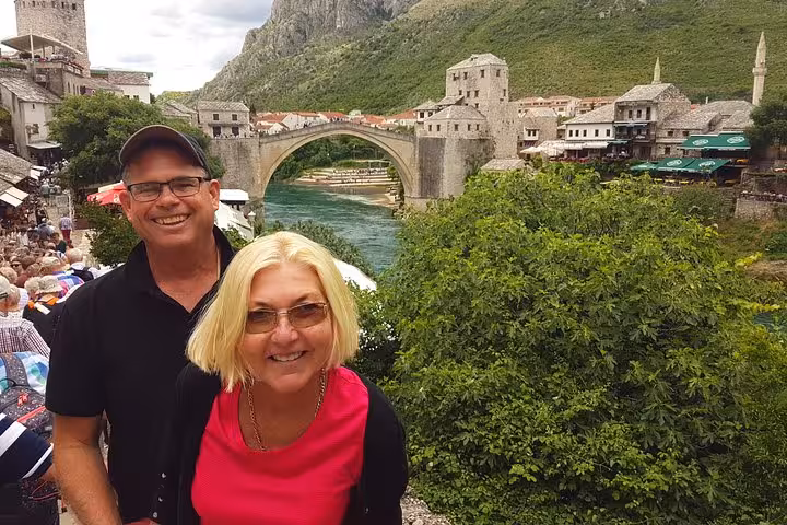 Travelers at Mostar Old Bridge, Bosnia and Herzegovina, iconic stop on 3-day Zagreb to Dubrovnik itinerary