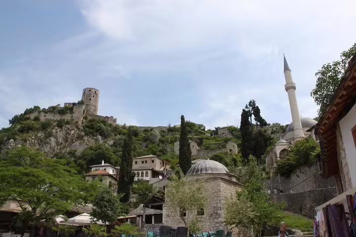 View of Mostar old town with mosque minaret and hillside fortress, visited on a Makarska Riviera day tour