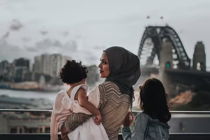 Mother with two children at Sydney Harbour Bridge lookout on a private travel photographer tour in Sydney