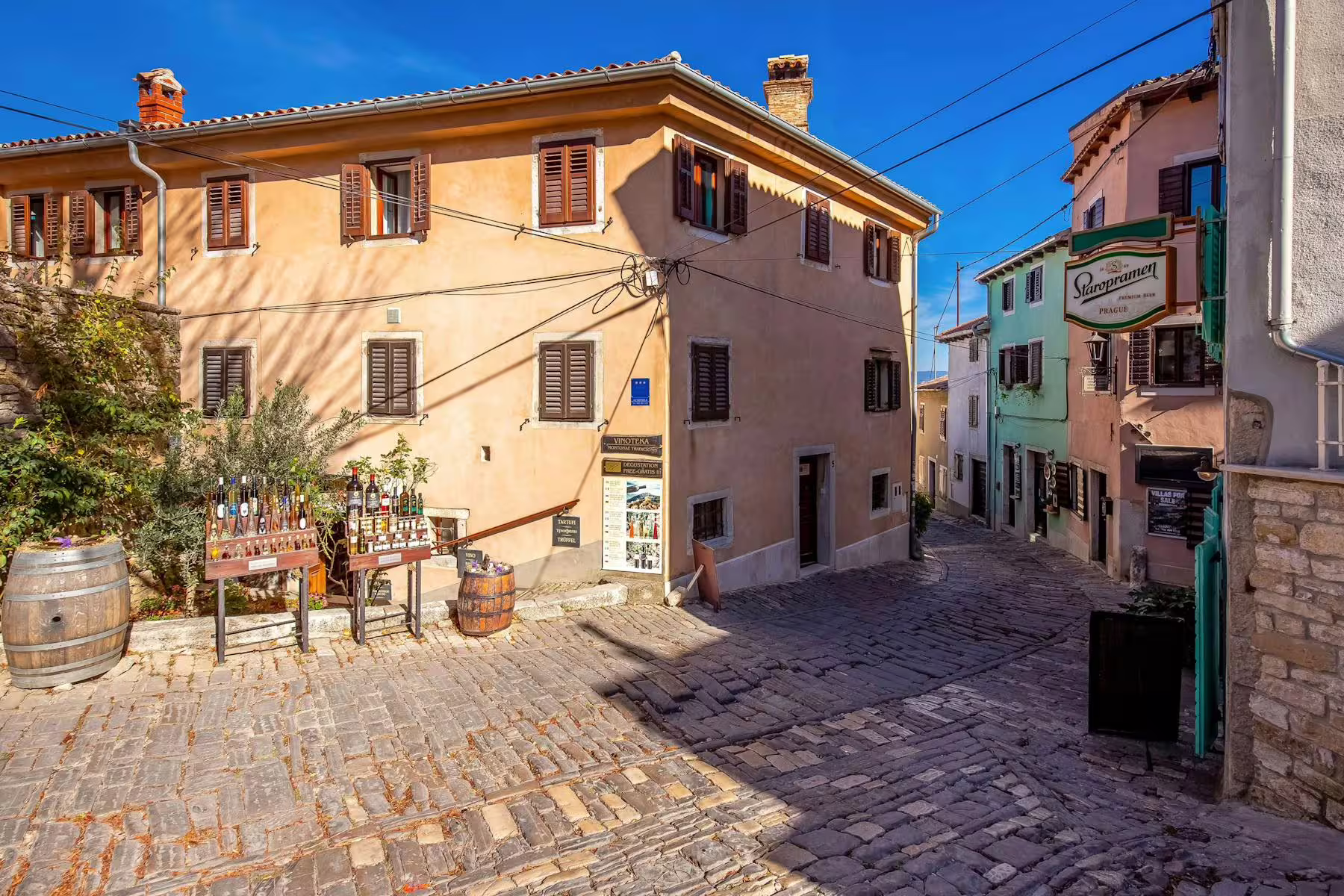 Motovun cobblestone street with local shop displays, stop on Istria half-day truffle and brandy tasting tour