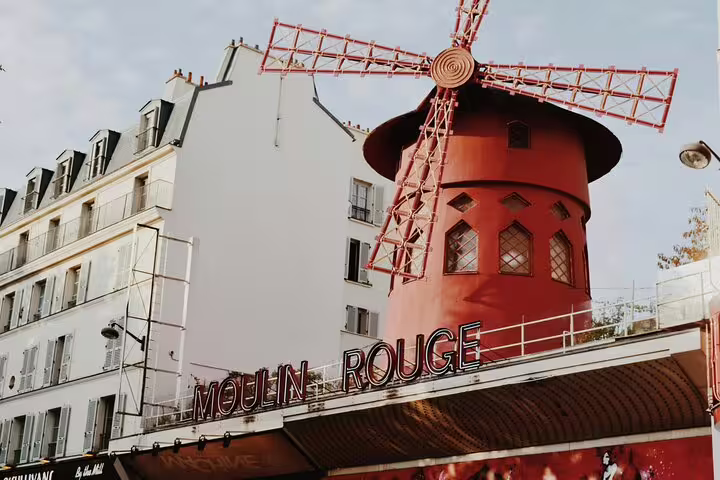 Moulin Rouge red windmill facade in Montmartre Paris