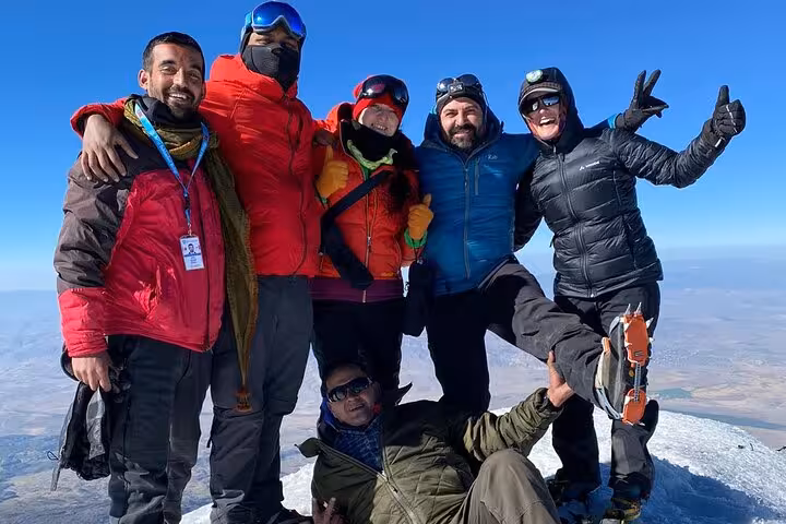 Summit celebration on Mount Ararat with guides and climbers on an all-inclusive 7-day private trekking tour