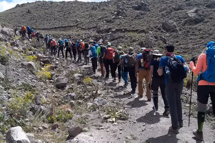 Hikers on Mount Ararat approach trail with trekking poles, part of an all-inclusive 7-day private climb