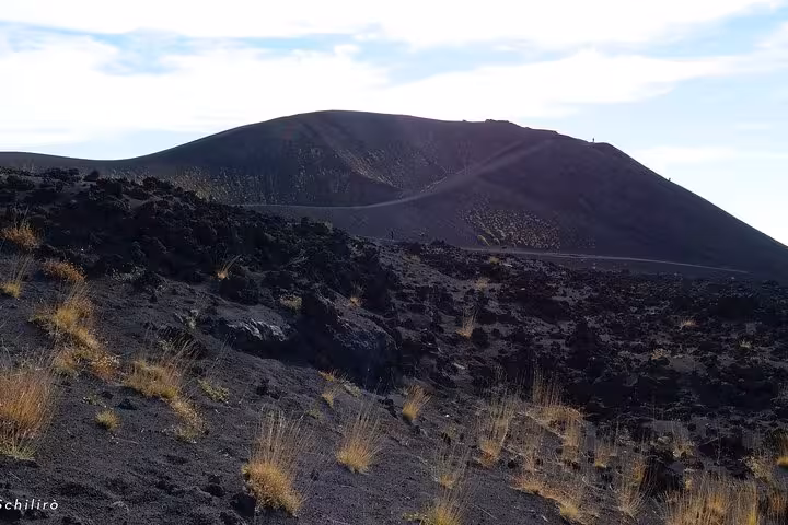 Explore the rugged volcanic landscapes of Mount Etna on the Etna and Taormina Tour, starting at 08:30 from your hotel.