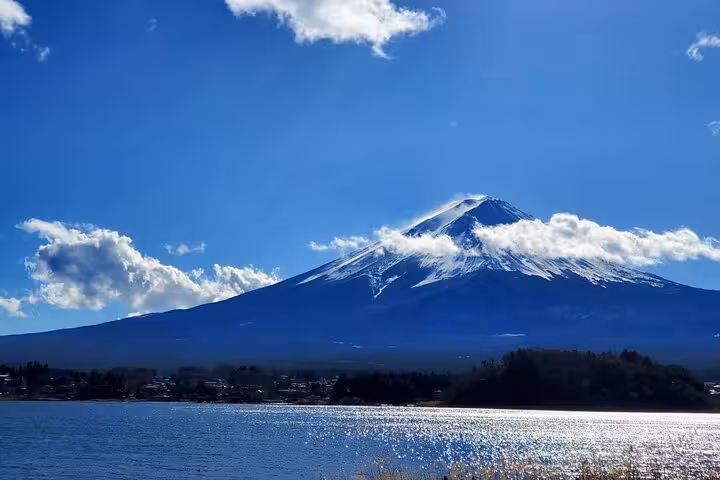 Snow-capped Mount Fuji reflected over Lake Kawaguchi on a guided Tokyo Hakone day tour
