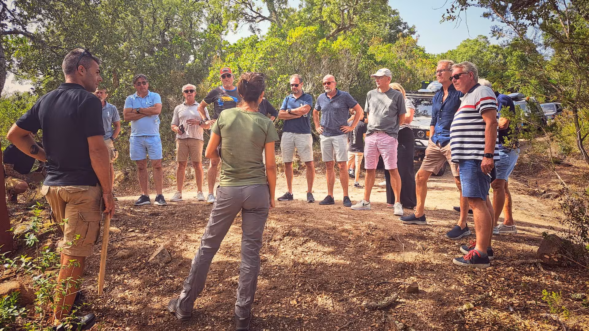 Tour guide briefing a group of tourists on the scenic jeep tour through Mount Limbara's natural landscape.
