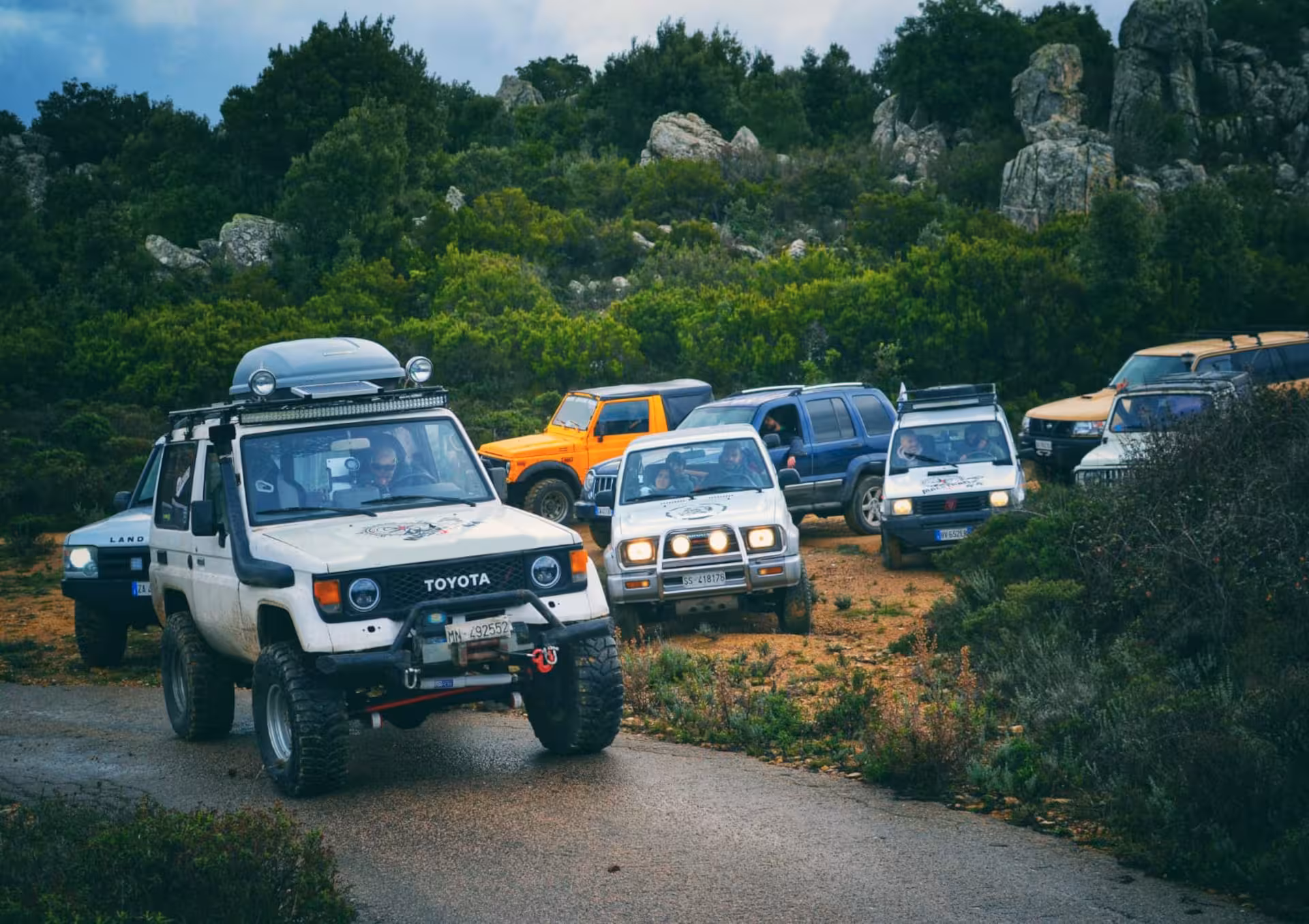 Convoy of off-road jeeps navigating rugged terrain on an exciting Mount Limbara jeep adventure tour.