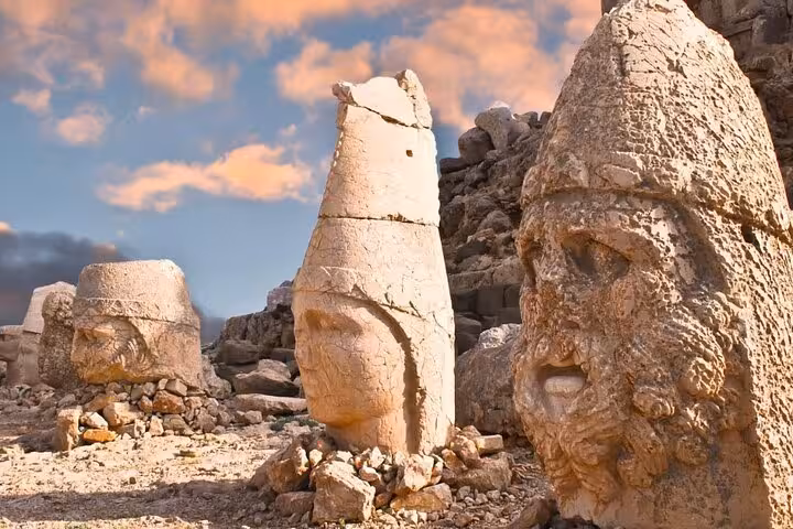 Giant carved stone heads at Mount Nemrut summit at sunset on 2-day 1-night Gobekli Tepe tour